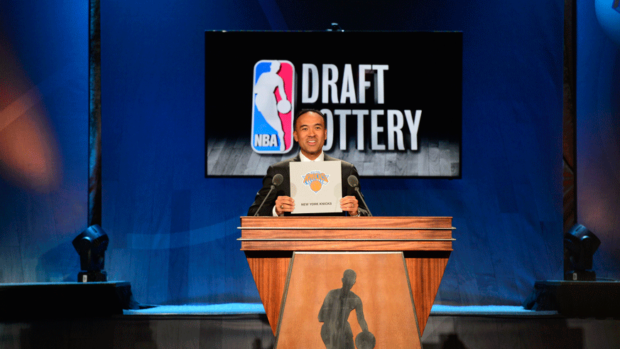 NBA assistant commissioner Mark Tatum reveals the Knicks' place in the 2015 NBA Draft Lottery. (Photo: Getty Images)