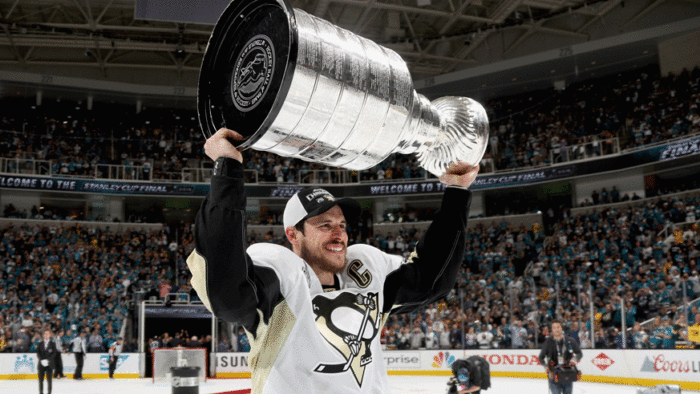 Pittsburgh Penguins captain Sidney Crosby lifts the Stanley Cup after defeating the San Jose Sharks in 2016. (Getty Images)