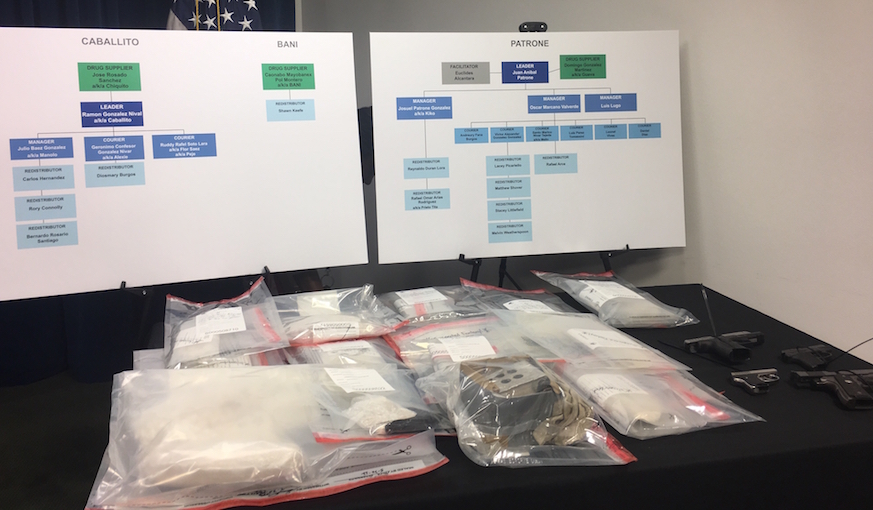 At a press conference Tuesday at the Moakley Courthouse, federal authorities displayed suspected fentanyl and guns they seized in an early-morning sweep of an alleged drug trafficking operation based in Lawrence.