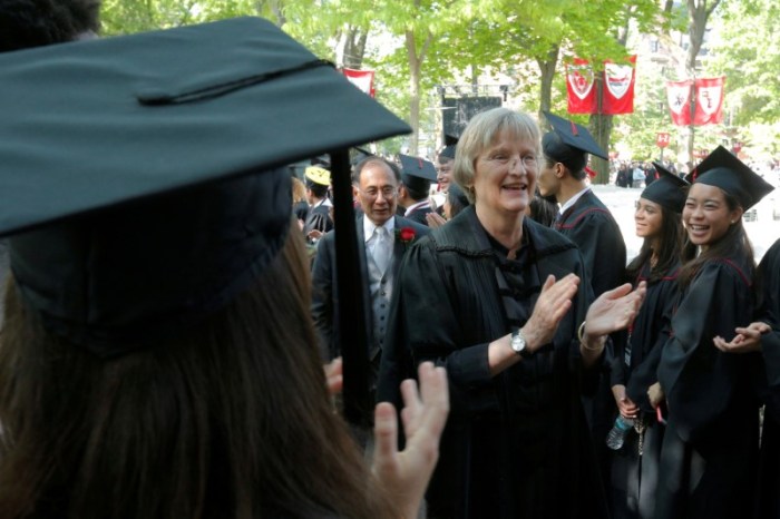 University President Drew Faust greets graduating students as she takes the stage for the 365th Commencement Exercises at Harvard University in Cambridge, Massachusetts, U.S. on May 26, 2016. REUTERS/Brian Snyder