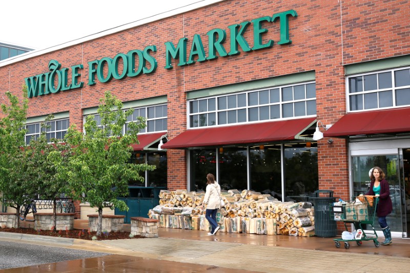 Customers leave the Whole Foods Market in Boulder, Colorado May 10, 2017. REUTERS/Rick Wilking