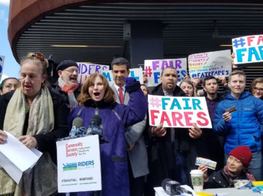 Advocates for "Fair Fares" rally on March 19, 2017.
