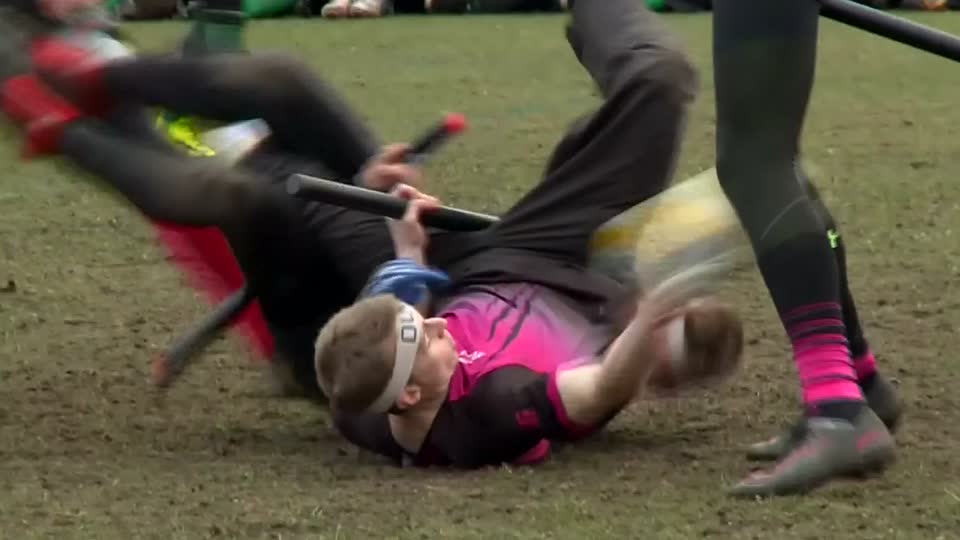 With poles between their legs, players compete in British Quidditch Cup