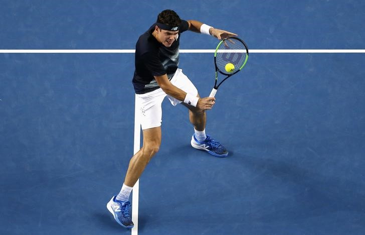 Top surviving seed Raonic safely into last eight