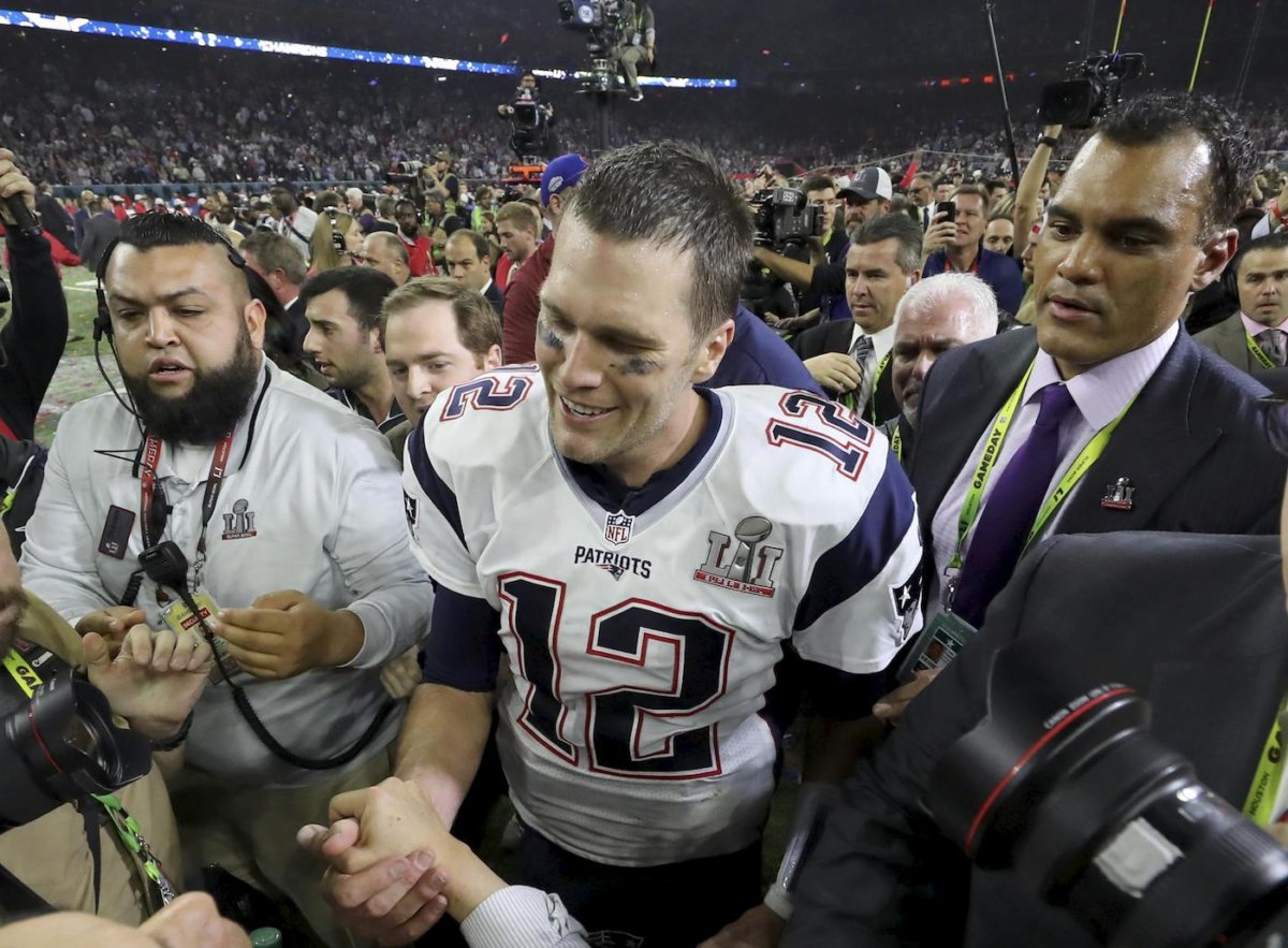 Brady loses his shirt, but smiling after emotional Super win
