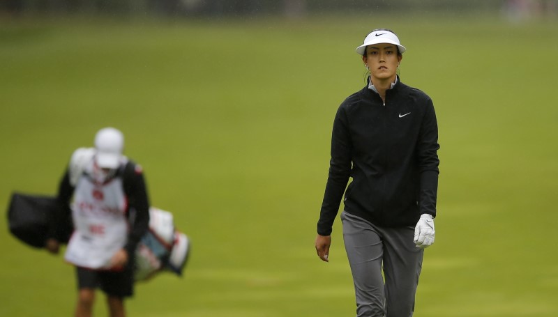 Wie uses helping hands to climb up Singapore leaderboard