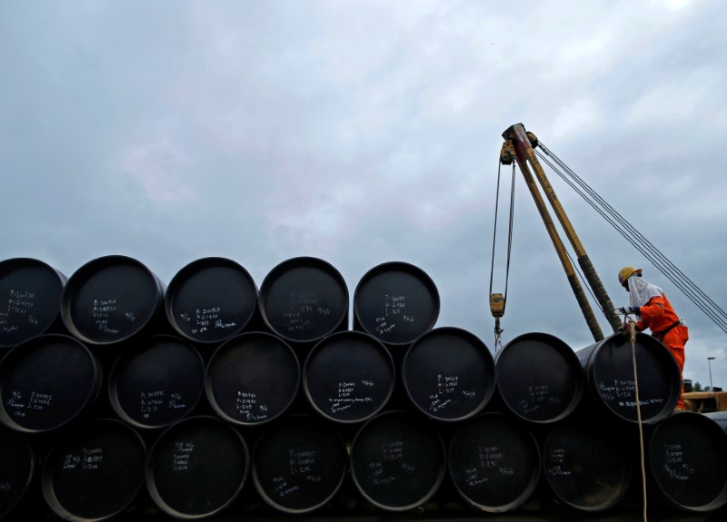 Oil at two-month high, ends above $50 a barrel