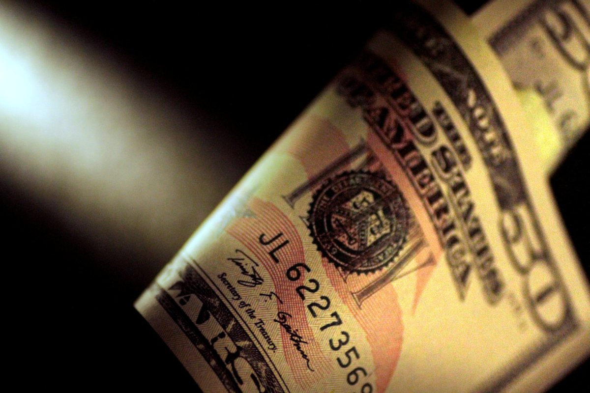Dollar inches up from 2-1/2 year low vs. euro; focus on U.S. data
