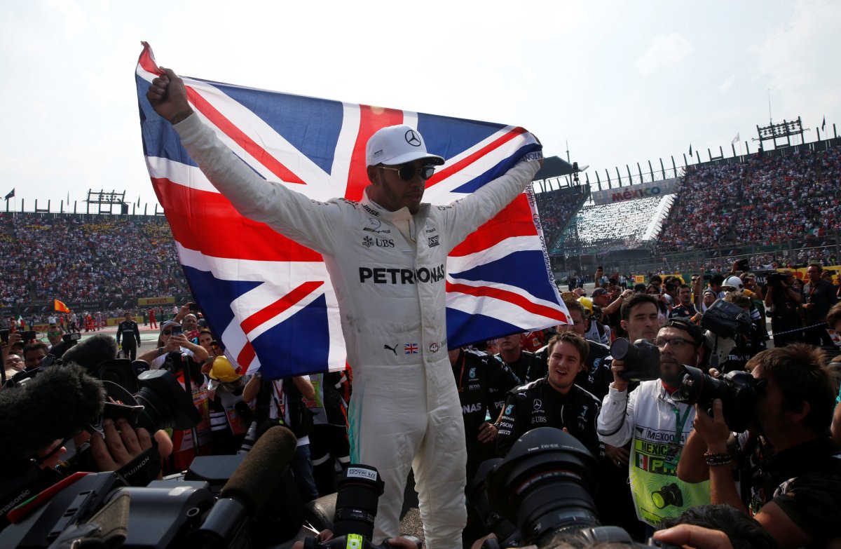 Motor racing: Four titles are great, but Hamilton wants more