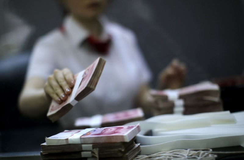 China to cap overseas withdrawals using domestic bank cards