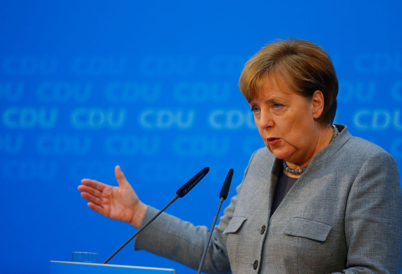 Merkel’s allies, further defying SPD, seek cuts to tax and asylum seeker