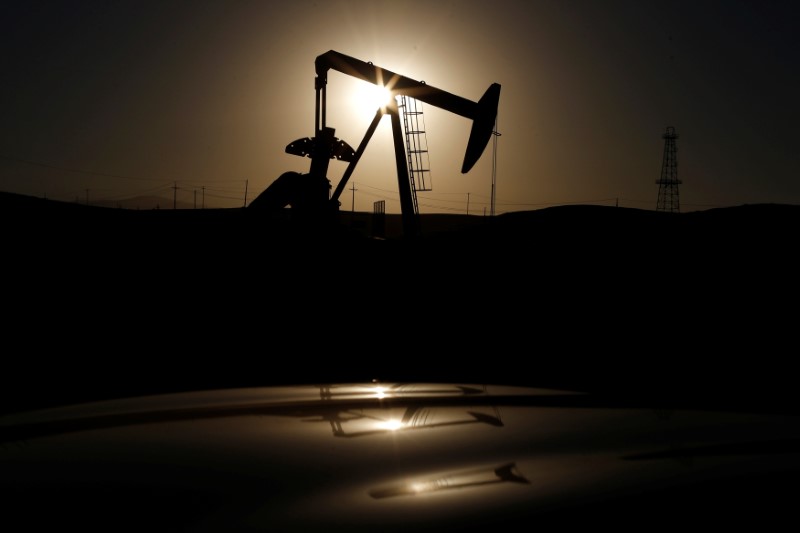Oil prices hold near 2015 highs, but doubts over rally emerge