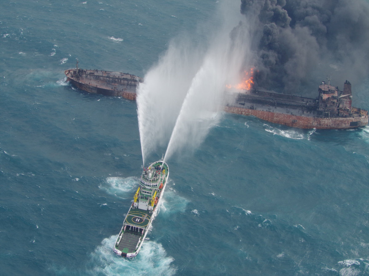 Chinese salvagers recover two bodies from flaming Iranian tanker
