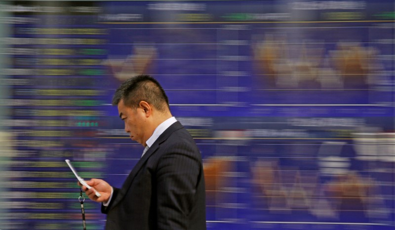 Asia tech shares spooked by phone warning, oil near highs