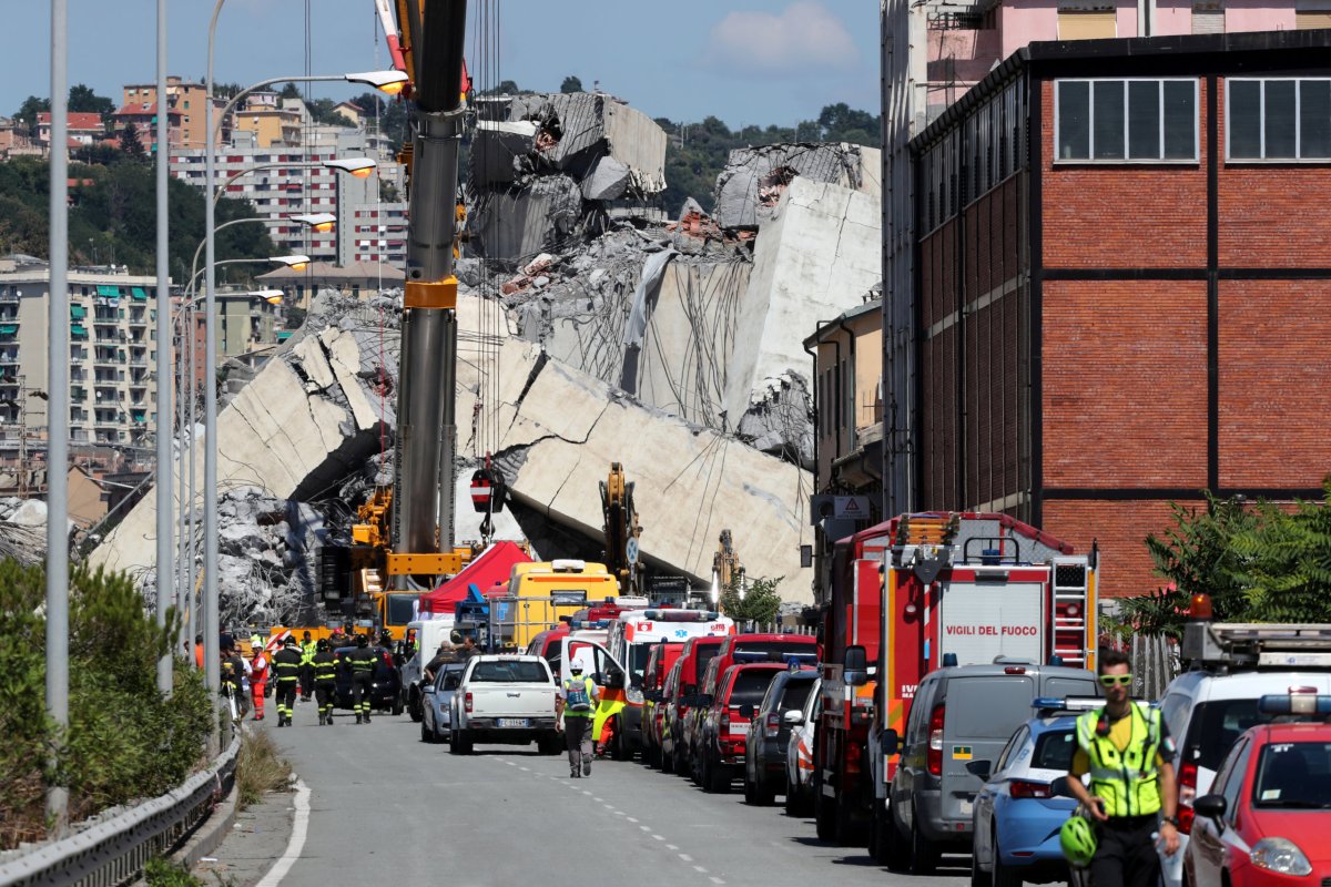 Rescuers deal with fire in Italian bridge rubble before day of mourning