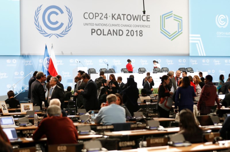 U.N. climate talks run into overtime, but deal “in reach”