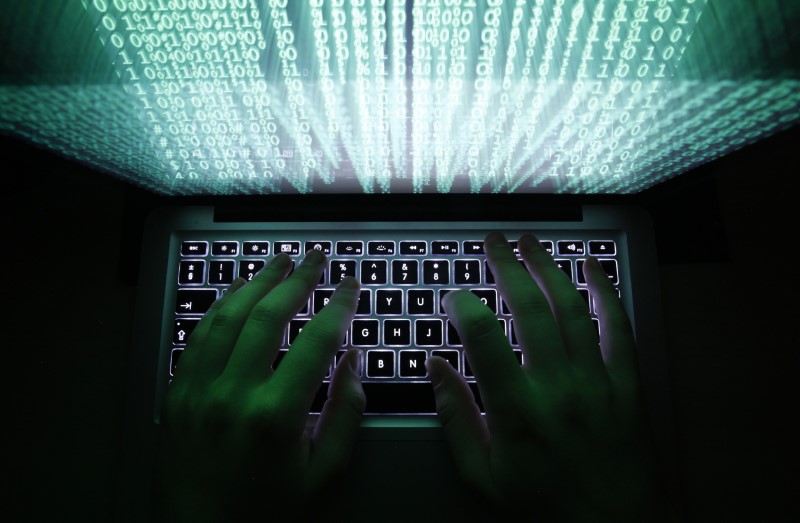 UK blames Russia for cyber attack, Moscow decries Western campaign