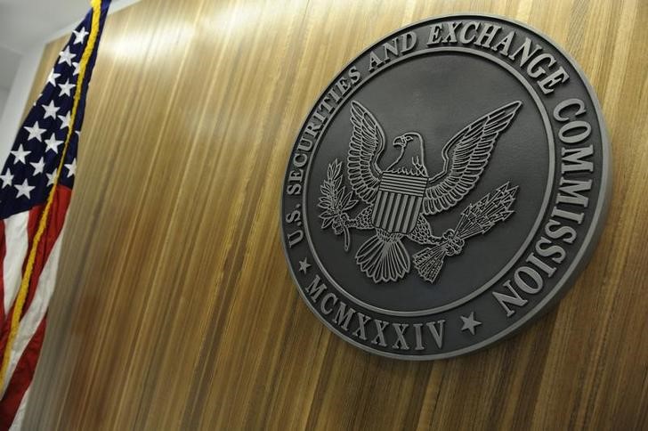 SEC investigates Overstock token sale, shares slide
