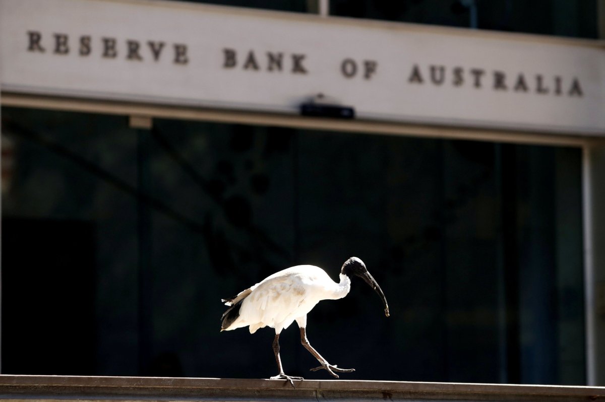 Australia’s central bank holds rates, sounds less upbeat on growth