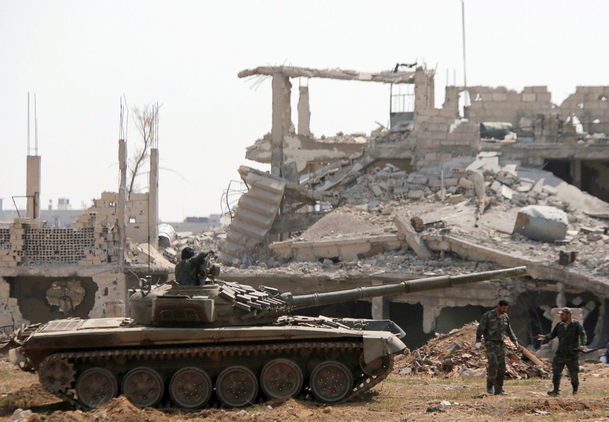 Syria seeks to crush insurgent pocket, denies evacuation deal
