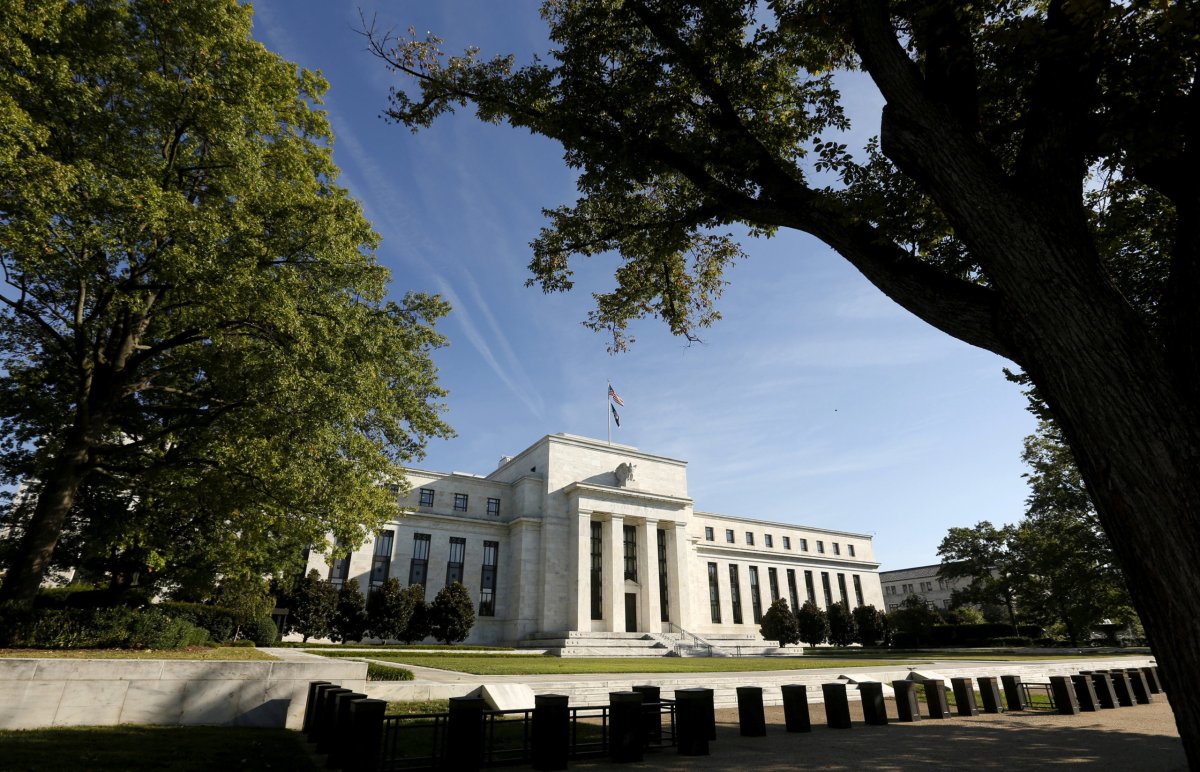 Fed holds rates steady, says economy remains on track