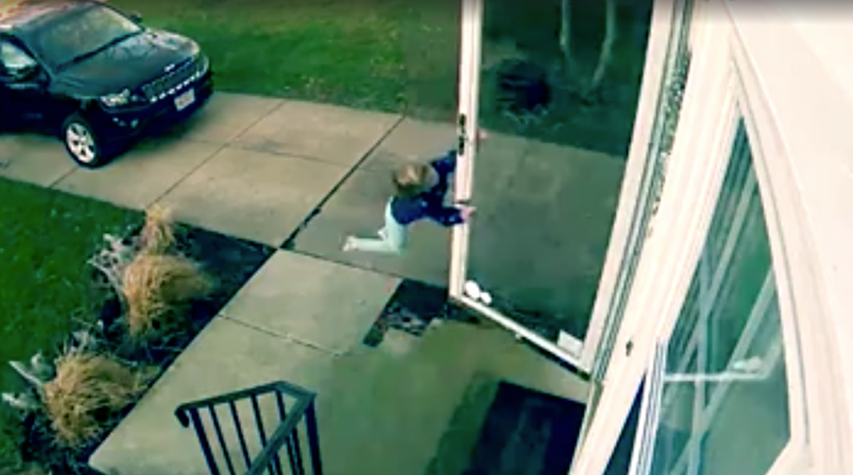 WATCH: Young girl hangs onto door as strong wind sweeps her off her feet