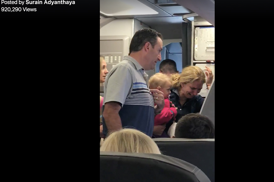 An American Airlines employee was suspended after striking a passenger with a stroller.