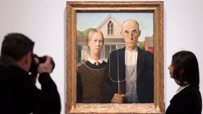 Grant Wood: American Gothic and Other Fables is on display now through June 10 at the Whitney Museum. Credit: Getty Images