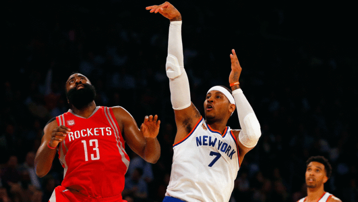 Knicks star Carmelo Anthony shoots a jumper over Rockets guard James Harden. (Photo: Getty Images)