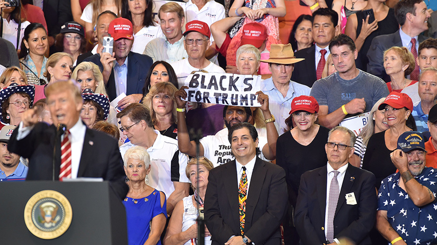 Who was the guy holding the ‘Blacks for Trump 2020’ sign at Trump’s rally?