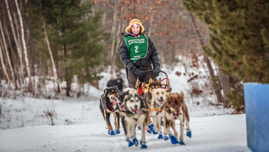 This professional dogsled team will mail your holiday cards for you