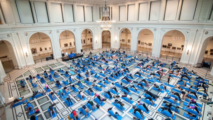 Art & Yoga is now a regular monthly event at the Brooklyn Museum thanks to the sponsorship of Adidas. Credit: Kolin Mendez