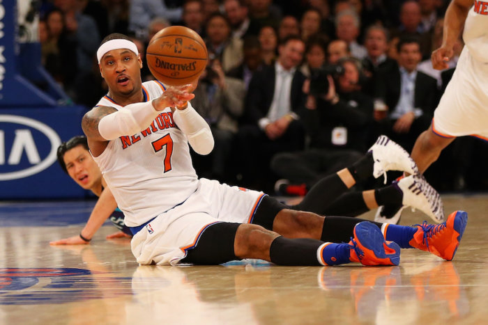 Knicks star Carmelo Anthony recovers a loose ball and looks to start the break.