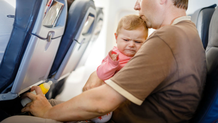 How to avoid crying babies on airplanes