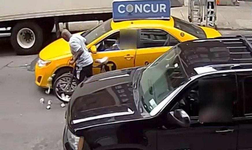 A robbery suspect is wanted for carrying out seven thefts by biking up to open cab windows and grabbing cash from drivers. (Photo via NYPD)