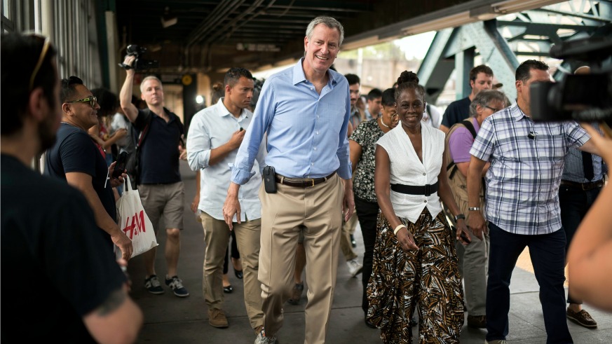 Mayor Bill de Blasio locked in city funding for his reelection campaign and agreed to debate his fellow candidates.