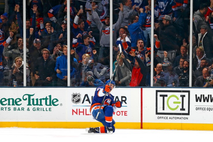 Devon Toews of the New York Islanders celebrates his first NHL goal, an OT game-winner over the Blackhawks. (Photo: Getty Images)