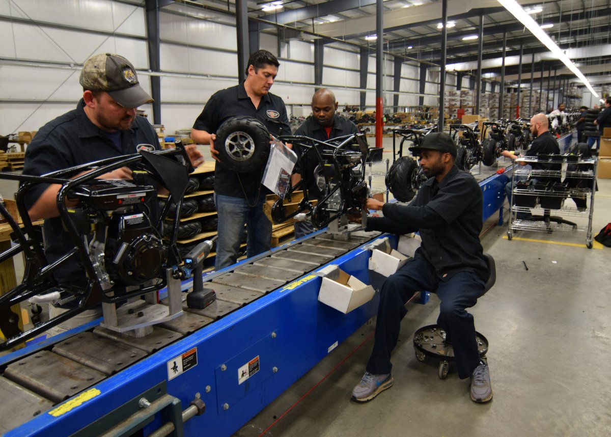 Workers construct mini-bikes at motorcycle and go-kart maker Monster Moto in Ruston, Louisiana.