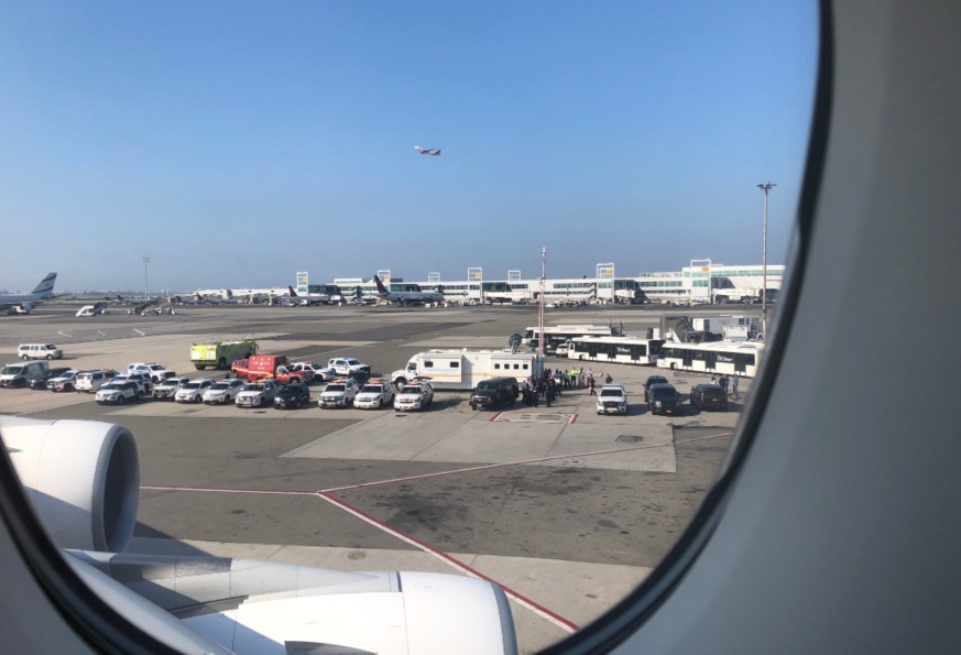 Passenger Larry Coben shared this photo of emergency crews and health officials awaiting Emirates Flight 203 on a runway at JFK Airport after several passengers reported feeling ill during the flight. (Twitter/Larry Coben)