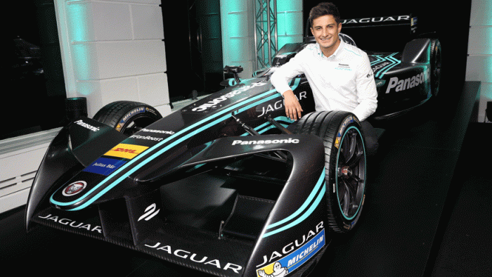 Team Jaguar's Mitch Evans posing with his team's new I-Type race car. (Photo: Getty Images)