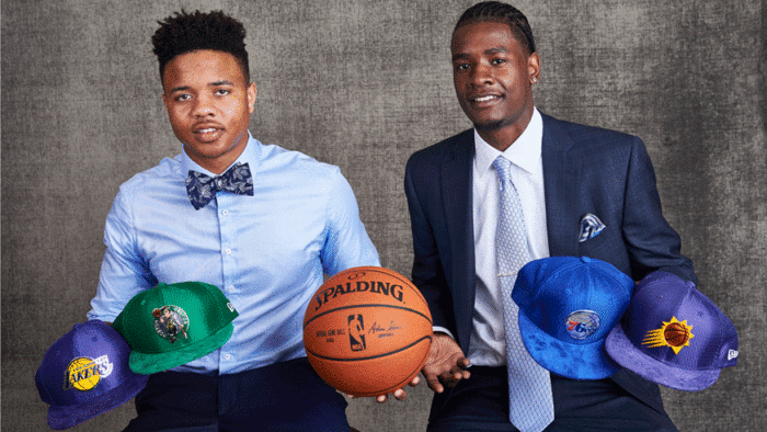 Markelle Fultz and Josh Jackson pose with NBA team hats before the 2017 NBA draft lottery. (Photo: Getty Images)