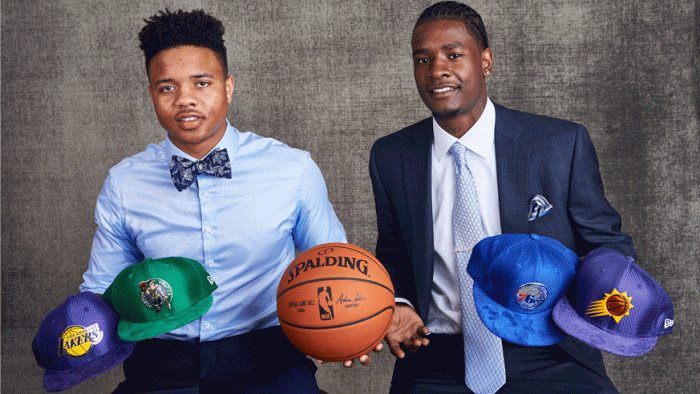 Markelle Fultz and Josh Jackson pose with NBA team hats before the 2017 NBA draft lottery. (Photo: Getty Images)