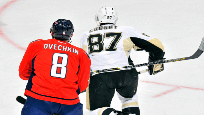 Two of the best in the NHL, Alex Ovechkin of the Capitals and Sidney Crosby of the Penguins, chase after a loose puck. (Getty Images)