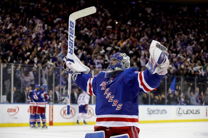 Rangers goalie Henrik Lundqvist celebrates his team's goal during Game 6 of the Eastern Conference quarterfinals against the Canadiens. (Getty Images)