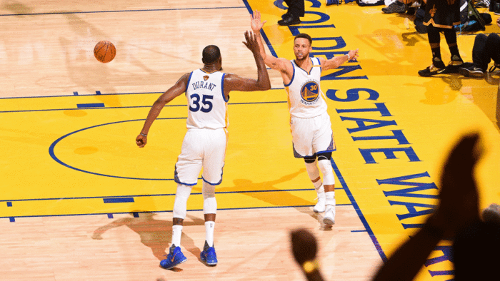 Kevin Durant and Stephen Curry of the Golden State Warriors celebrate during Game 2 of the 2017 NBA Finals. (Photo: Getty Images)