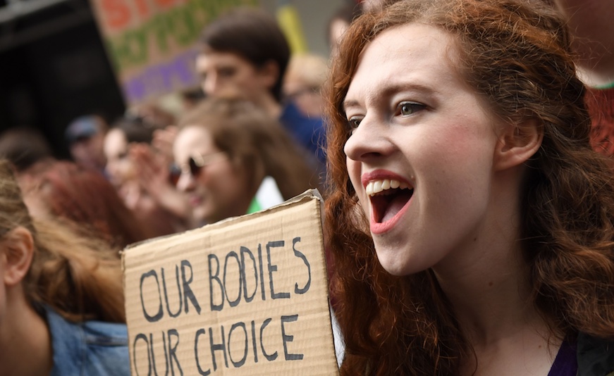 Protesters hold up placards during the London March for Choice, calling for the legalising of abortion in Ireland after the referendum announcement, outside the Embassy of Ireland in central London on September 30, 2017.