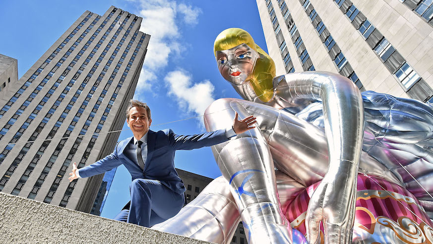 Jeff Koons with his Seated Ballerina, now on view in Rockefeller Center. Photo: Getty Images