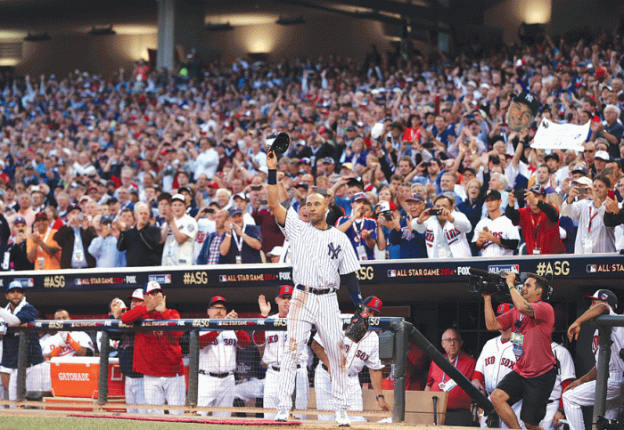New York Yankees shortstop Derek Jeter is saluted by the fans at Target Field in a game against the Minnesota Twins.