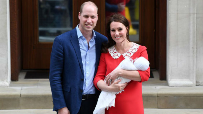new parents posing for royal photos