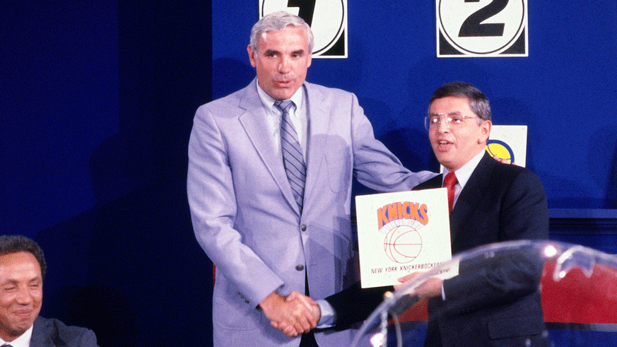 Then-Knicks GM Dave DeBusschere poses with former NBA Commissioner David Stern after New York won the first-overall pick in the 1985 NBA draft lottery. (Photo: Getty Images)